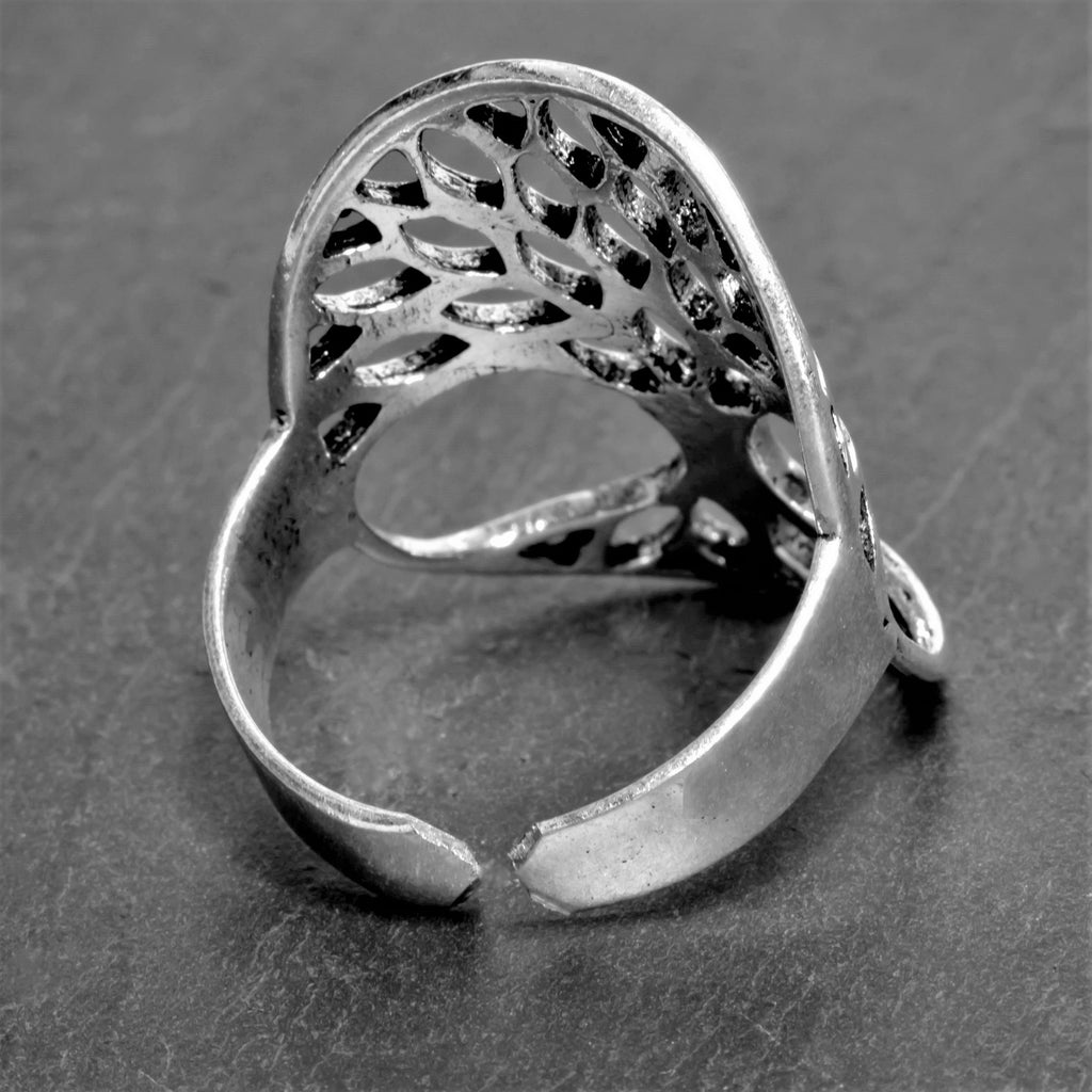An adjustable, handmade solid silver, open tree of life ring designed by OMishka.