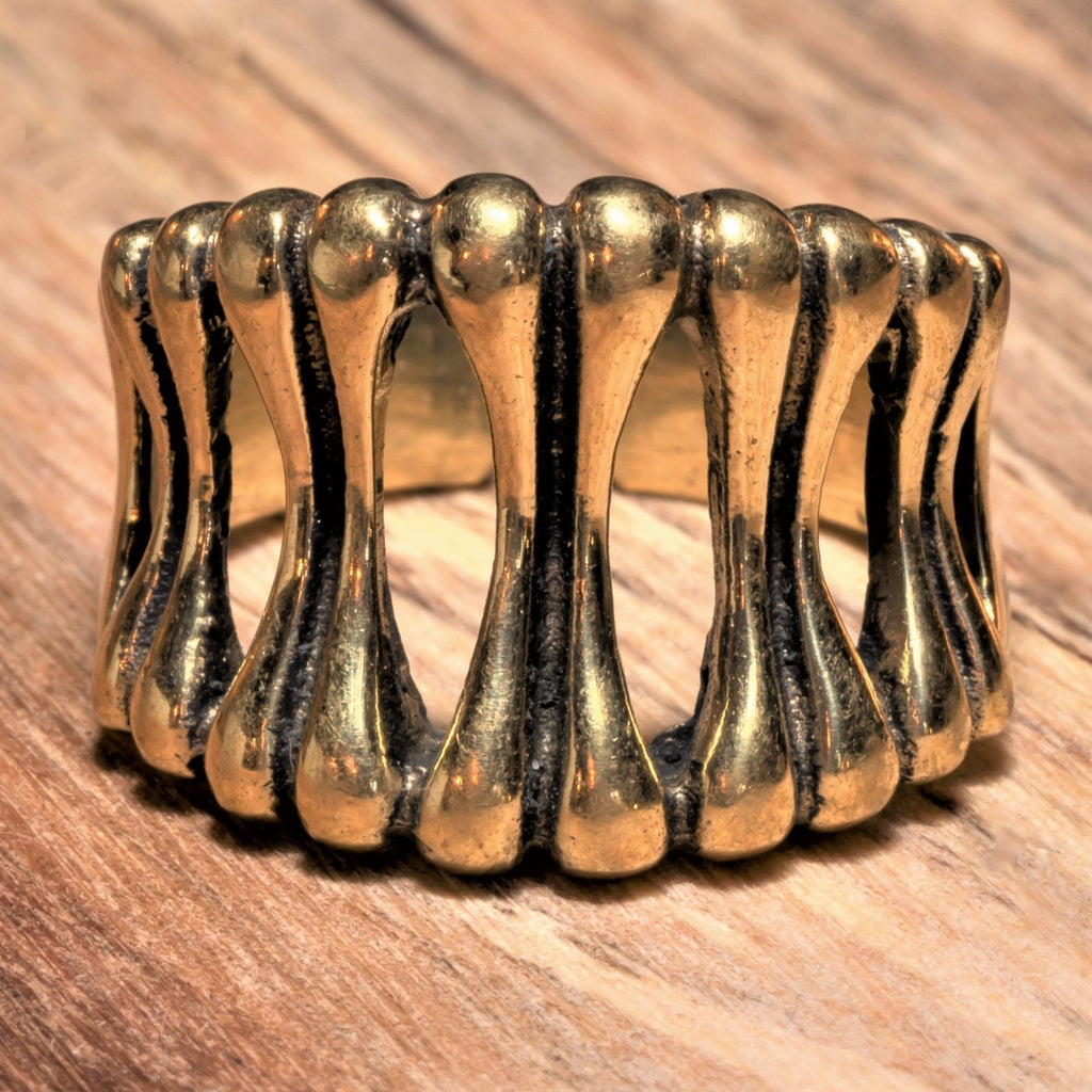 An adjustable, artisan handmade pure brass, skeletal bone shaped ring designed by OMishka.
