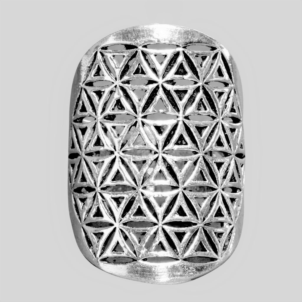 A large, adjustable, artisan handmade solid silver, flower of life ring designed by OMishka.
