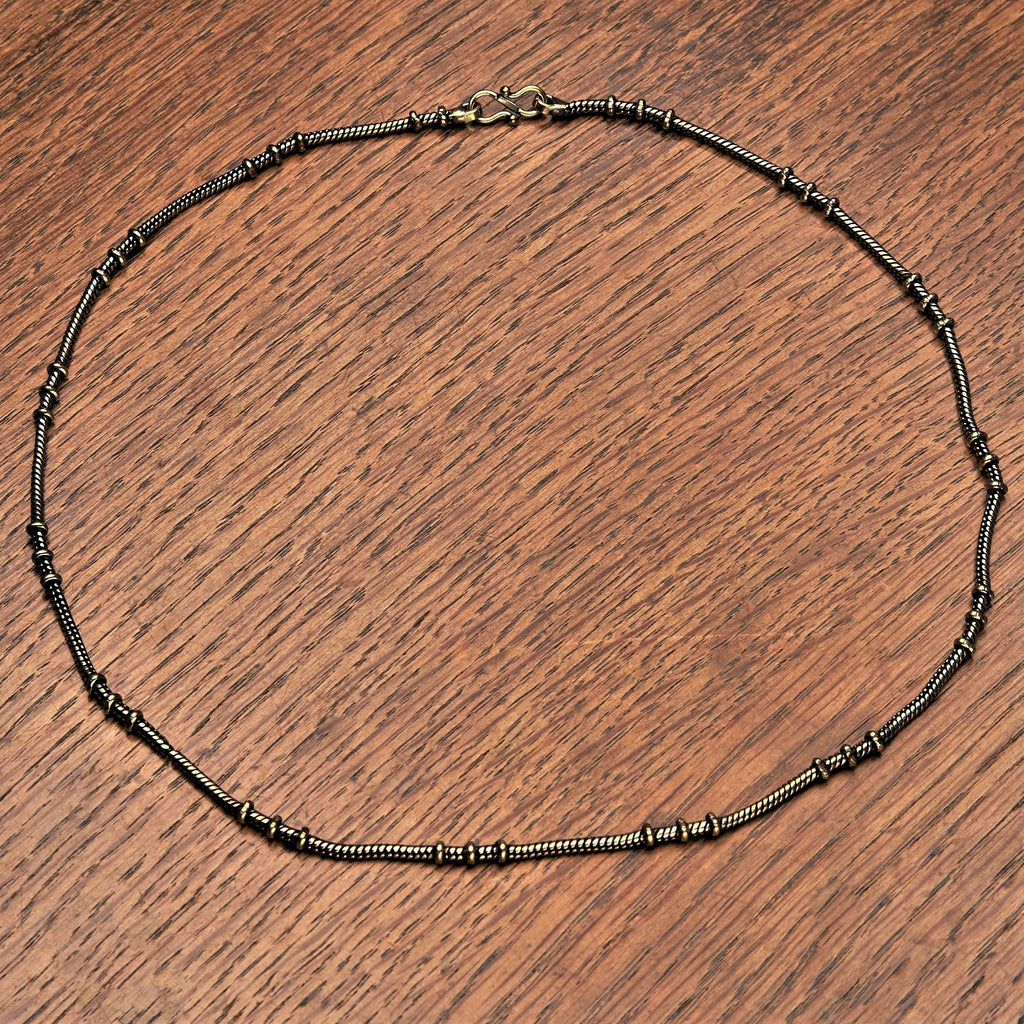 Artisan handmade pure brass, disc beaded snake chain necklace designed by OMishka.