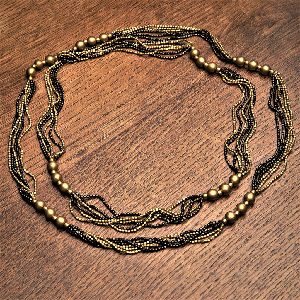 Handmade and nickel free, striped pure golden and black brass, beaded, long multi strand necklace designed by OMishka.