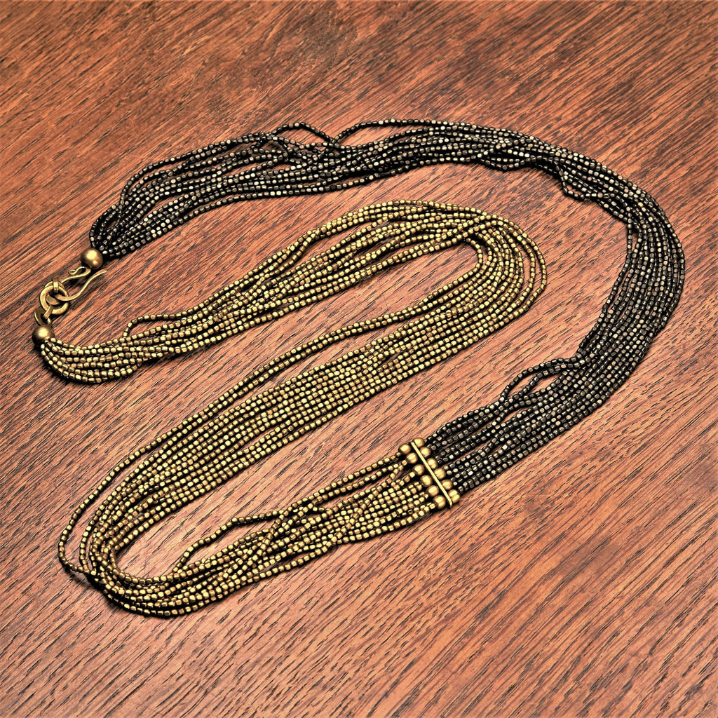 Handmade and nickel free, striped golden and black brass, long beaded multi strand necklace designed by OMishka.