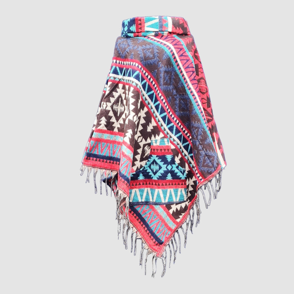 Colorful black patterned poncho with fringes on a light gray background