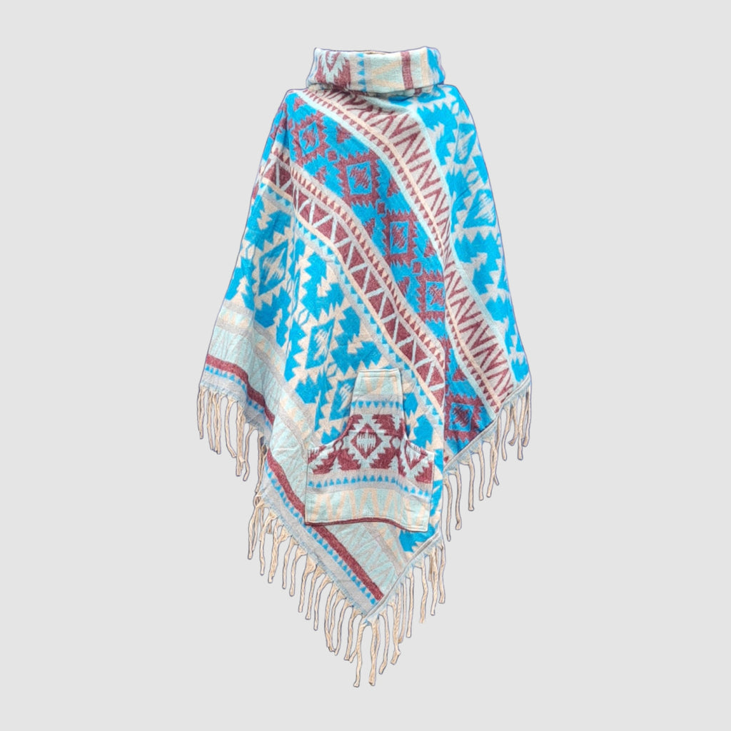 Colorful blue patterned poncho with fringes on a light gray background