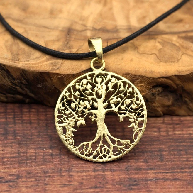 Brass round tree of life pendant.