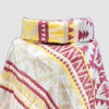 Colorful patterned cowl neck poncho with an Aztec design on a light gray background