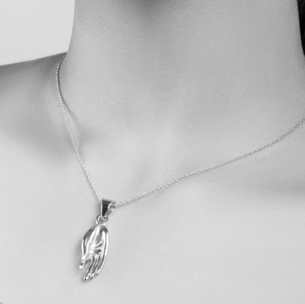 Silver Lord Buddha hand pendant.