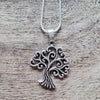 Silver open tree of life pendant.