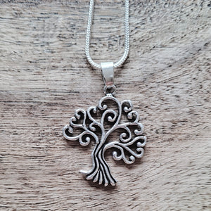 Silver open tree of life pendant.