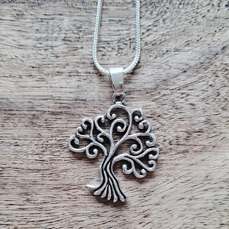 Silver open tree of life pendant.