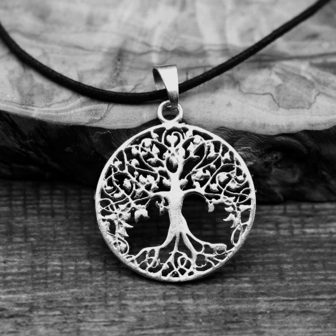 Silver round tree of life pendant.