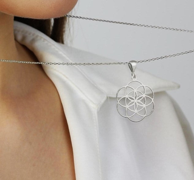 Silver seed of life sacred geometry pendant.