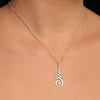 Silver necklace with a spiritual Unalome pendant on a silver chain.