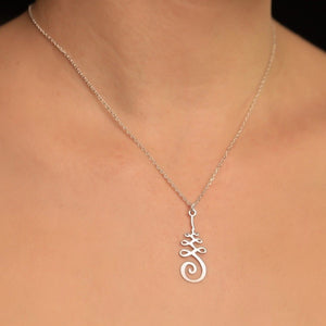 Silver necklace with a spiritual Unalome pendant on a silver chain.