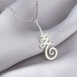 Silver necklace with a decorative Unalome pendant on a silver chain.