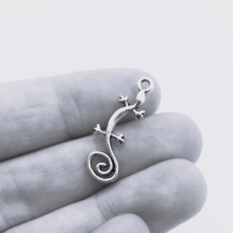 Tiny silver gecko pendant charm.