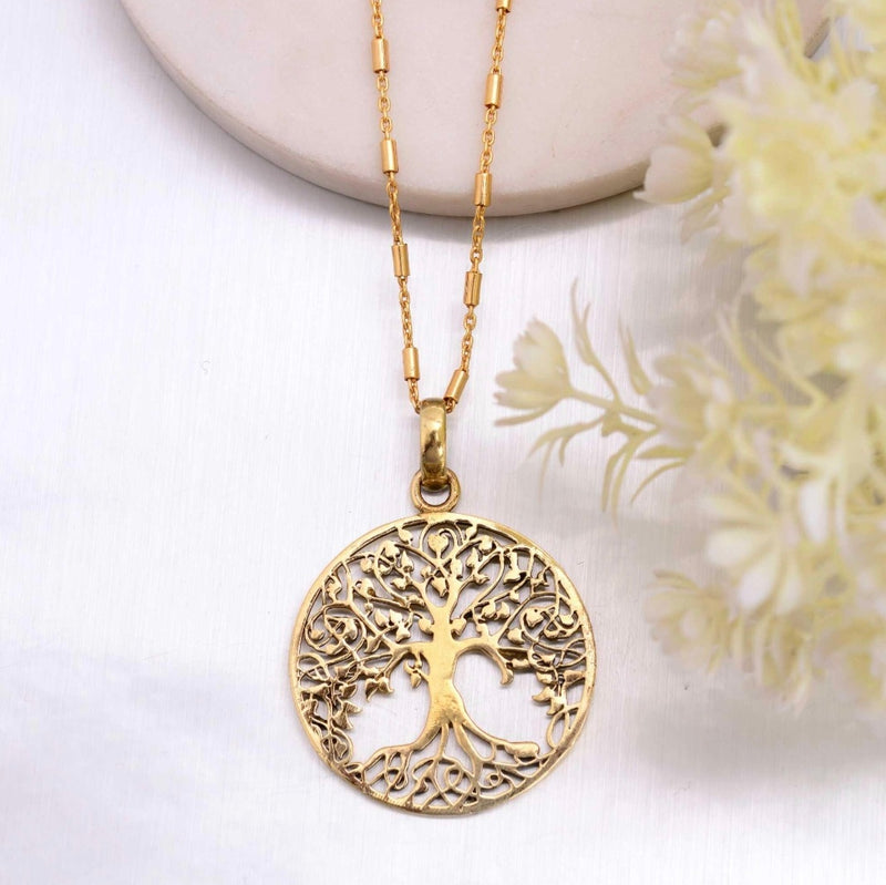 Brass disc tree of life pendant.