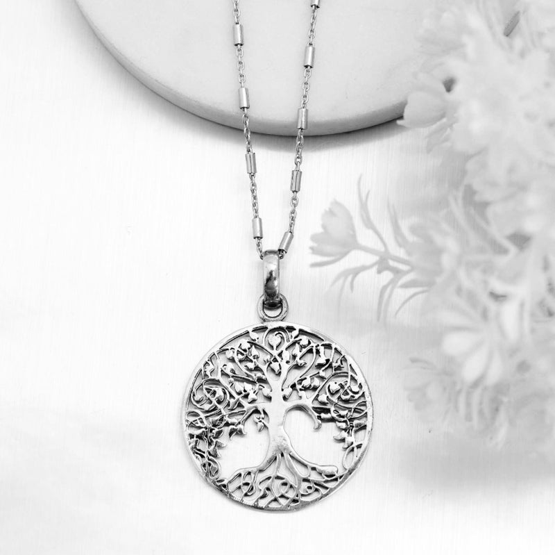 Silver disc tree of life pendant.