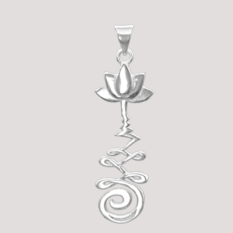 Silver pendant with unalome and lotus flower design.