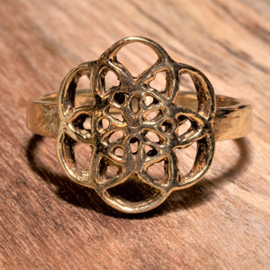An adjustable, dainty, artisan handmade pure brass seed of life ring designed by OMishka.