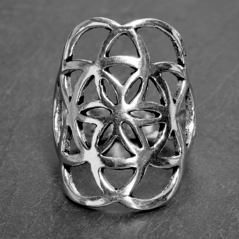An adjustable, artisan handmade solid silver, seed of life ring designed by OMishka.