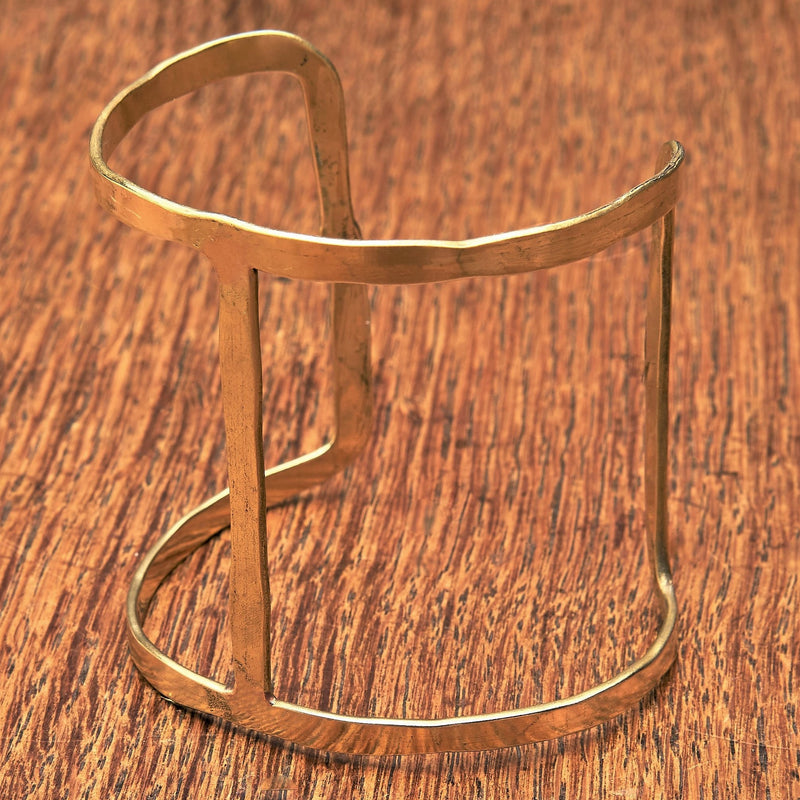 An artisan handmade unique, open H shaped pure brass cuff bracelet designed by OMishka.