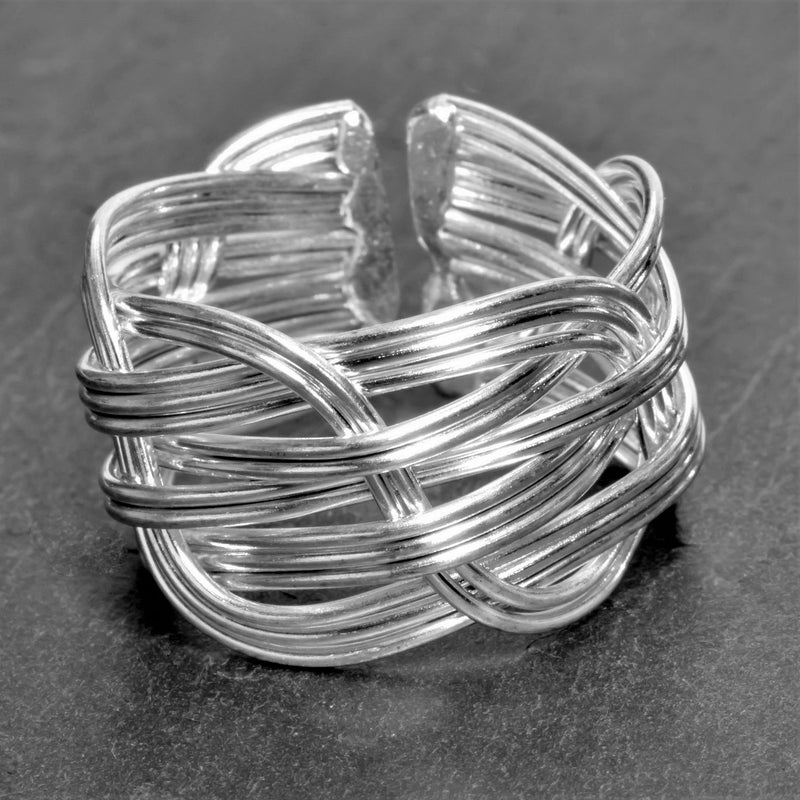 An adjustable, chunky, artisan handmade, open braided solid silver ring designed by OMishka.