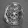 A large, adjustable, artisan handmade solid silver, beaded flower of life ring designed by OMishka.