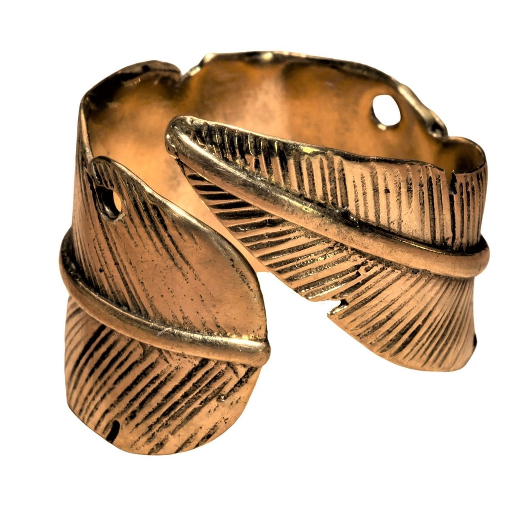 An adjustable, pure brass feather wrap ring designed by OMishka.