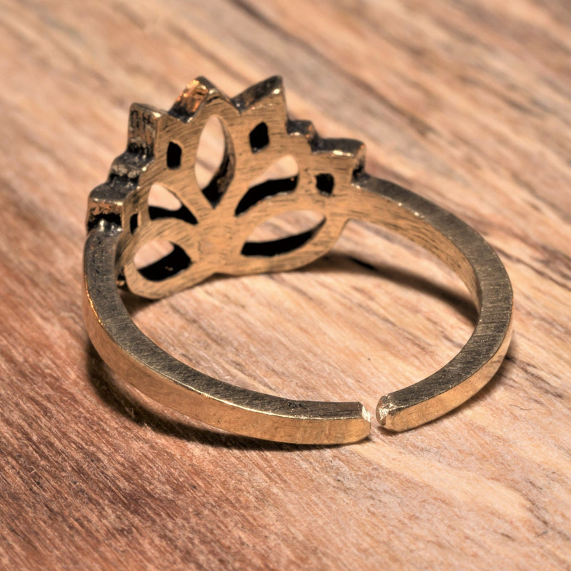An adjustable, dainty, pure brass lotus flower ring designed by OMishka.