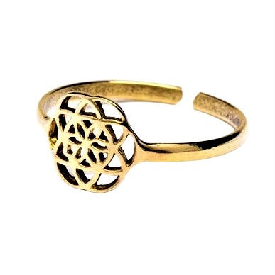 An adjustable, dainty, pure brass seed of life ring designed by OMishka.