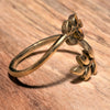 An adjustable, pure brass, dainty laurel leaf wrap ring designed by OMishka.