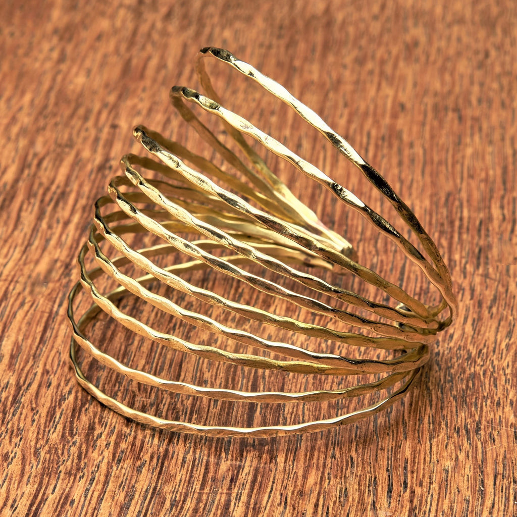 An adjustable hammered pure brass, multi strand bracelet cuff designed by OMishka.