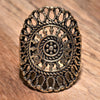 An adjustable, handmade pure brass filigree mandala ring designed by OMishka.