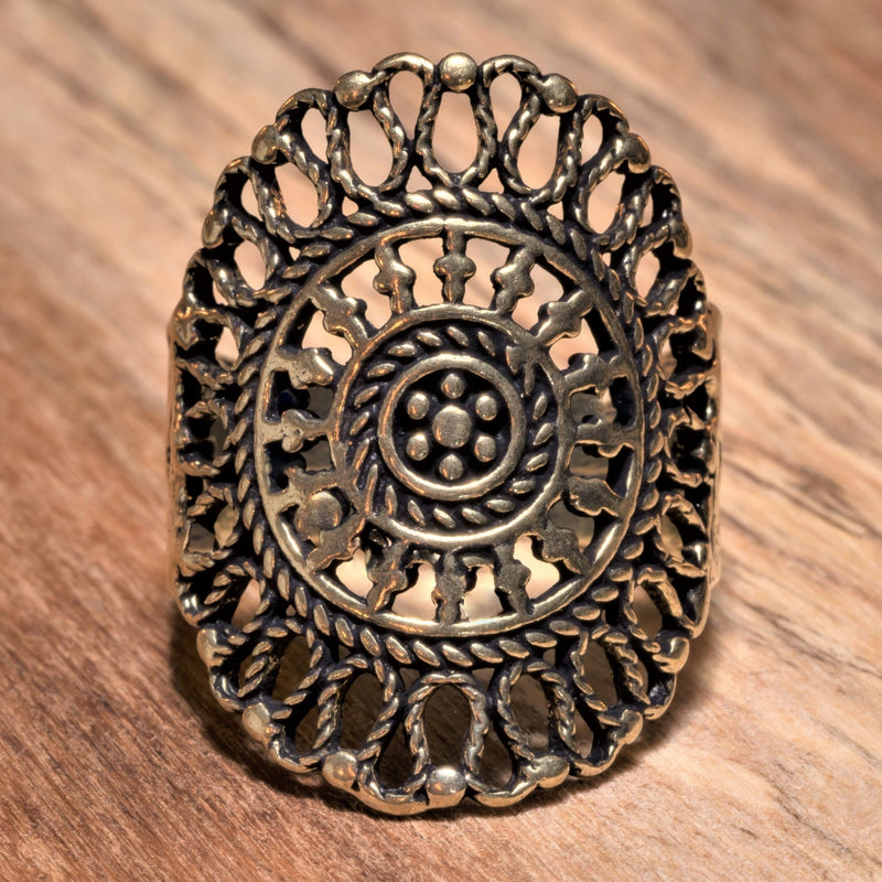 An adjustable, handmade pure brass filigree mandala ring designed by OMishka.