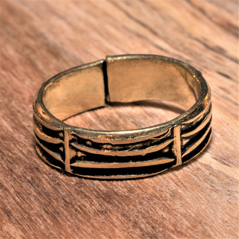An adjustable, handmade pure brass, etched tree bark patterned band toe ring designed by OMishka.