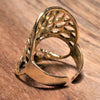 An adjustable, handmade pure brass open tree of life ring designed by OMishka.