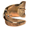 An adjustable, handmade and chunky, pure brass feather ring designed by OMishka.