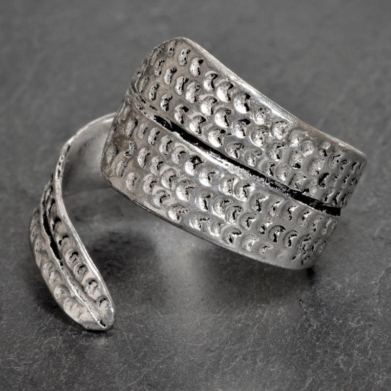 An adjustable, handmade solid silver, chunky dotted wrap ring designed by OMishka.