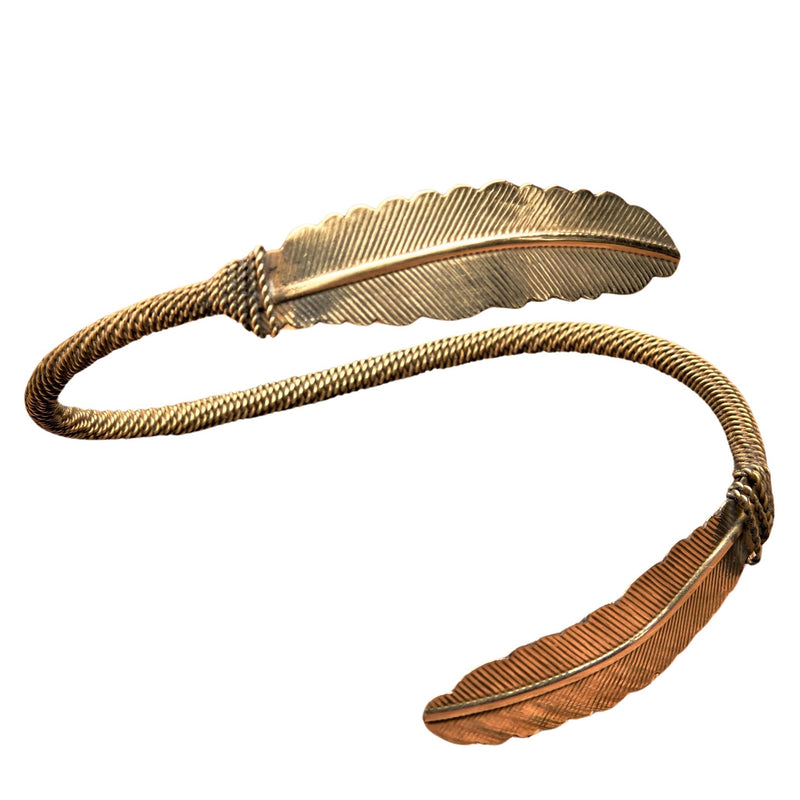 An adjustable, handmade double feather pure brass wrap bracelet designed by OMishka.