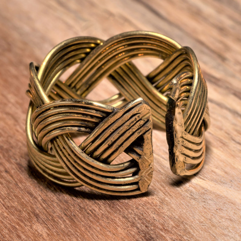 An adjustable, handmade and chunky, open plaited pure brass ring designed by OMishka.