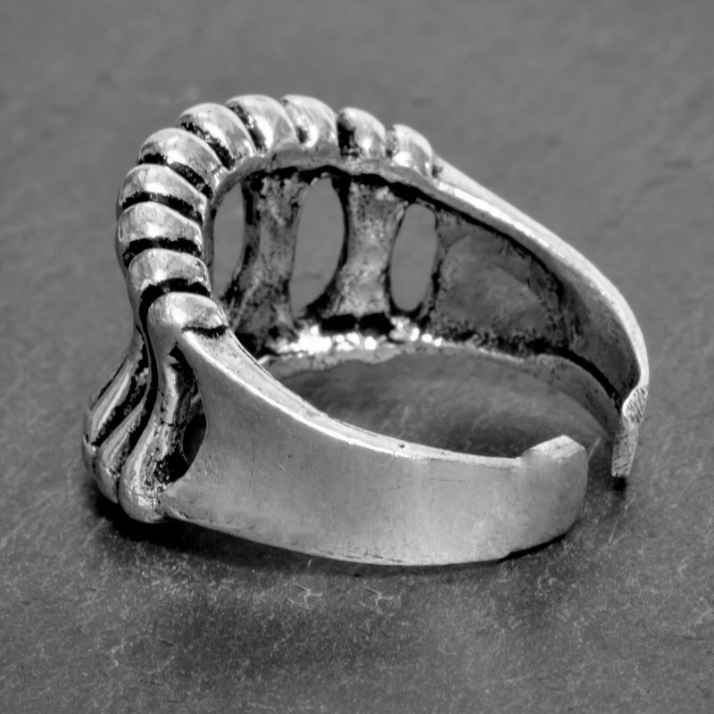 An adjustable, handmade solid silver, skeletal bone shaped band ring designed by OMishka.
