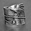 An adjustable, handmade solid silver, chunky wrap ring designed by OMishka.