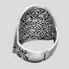 A large, adjustable, handmade solid silver flower of life ring designed by OMishka.