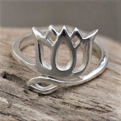 An adjustable, handmade solid silver, open lotus flower ring designed by OMishka.