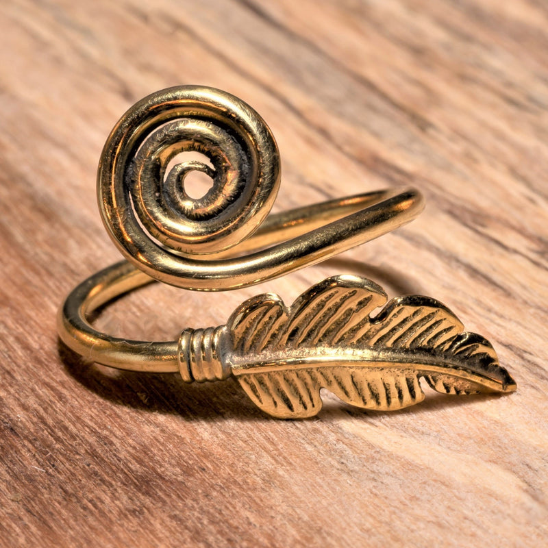An adjustable, nickel free pure brass, dainty feather spiral wrap ring designed by OMishka.