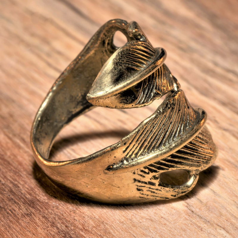 An adjustable, nickel free pure brass, double feather wrap ring designed by OMishka.