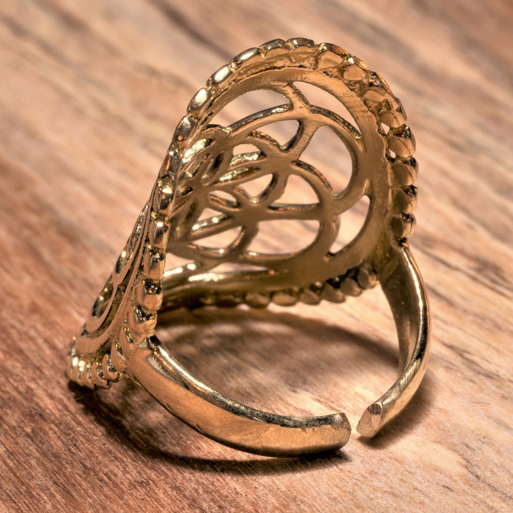 A large, adjustable, nickel free pure brass, beaded seed of life ring designed by OMishka.