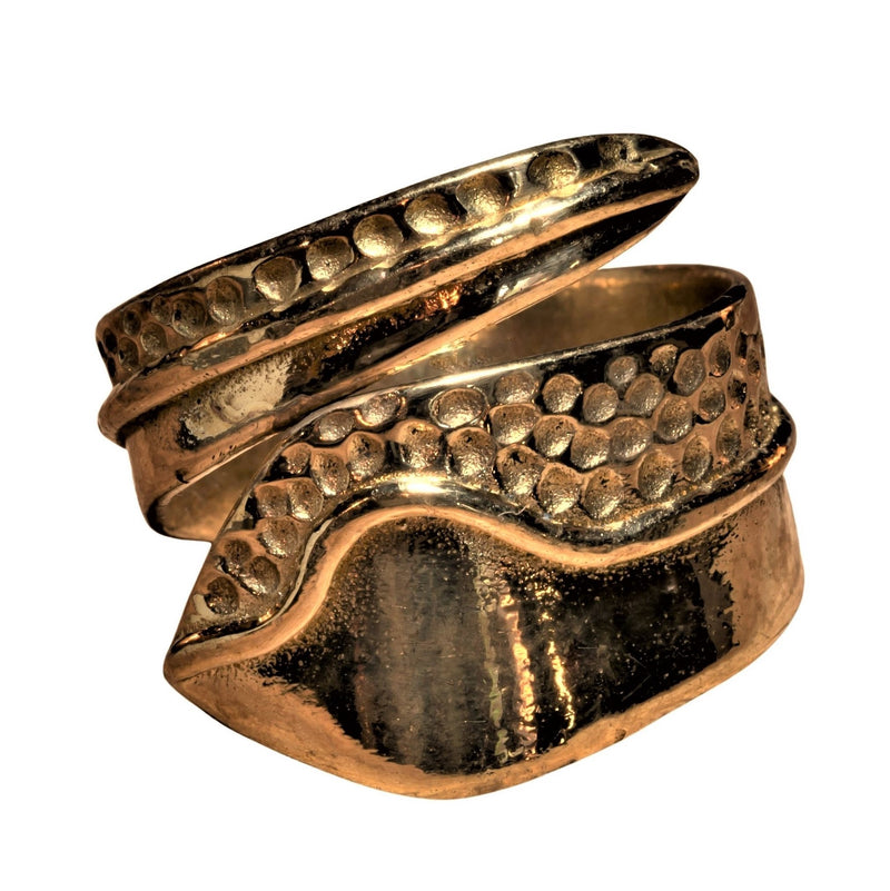 An adjustable, nickel free pure brass, swirl patterned wrap ring designed by OMishka.