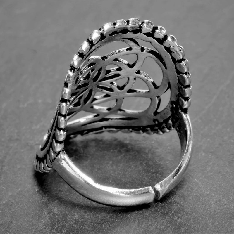 A large, adjustable, nickel free solid silver, beaded seed of life ring designed by OMishka.